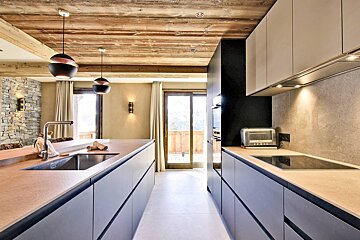 A kitchen with a sink and a toaster oven