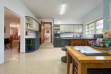 A bathroom with a jacuzzi tub and a bottle of wine