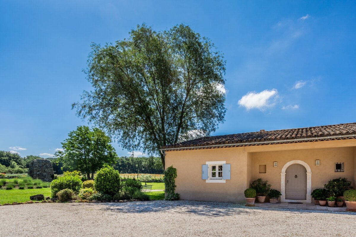 A house with a tree in front of it