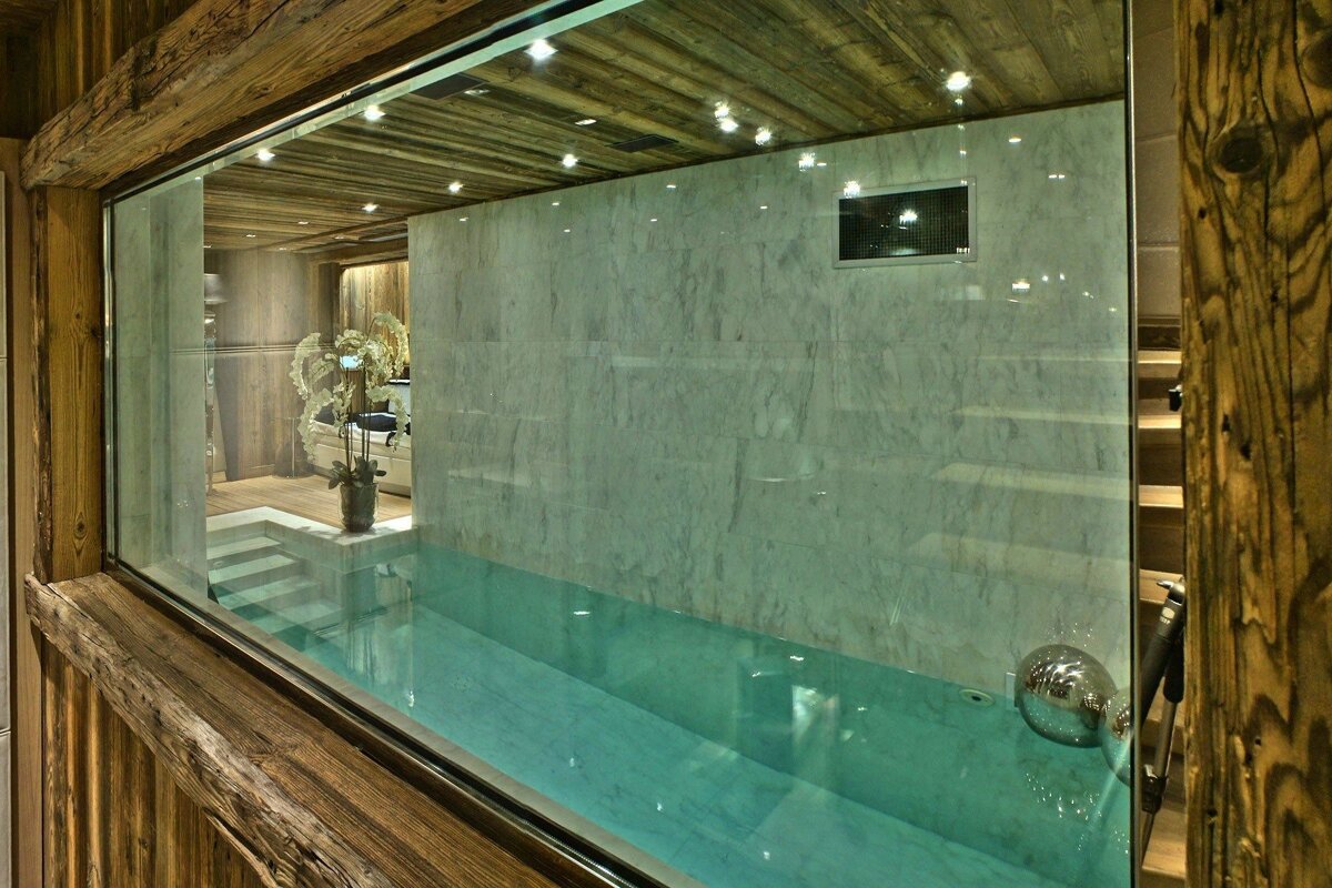 A view of a swimming pool through a glass window