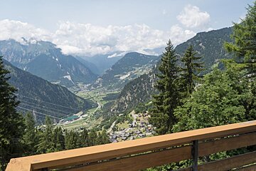 A view of a mountain valley from a balcony