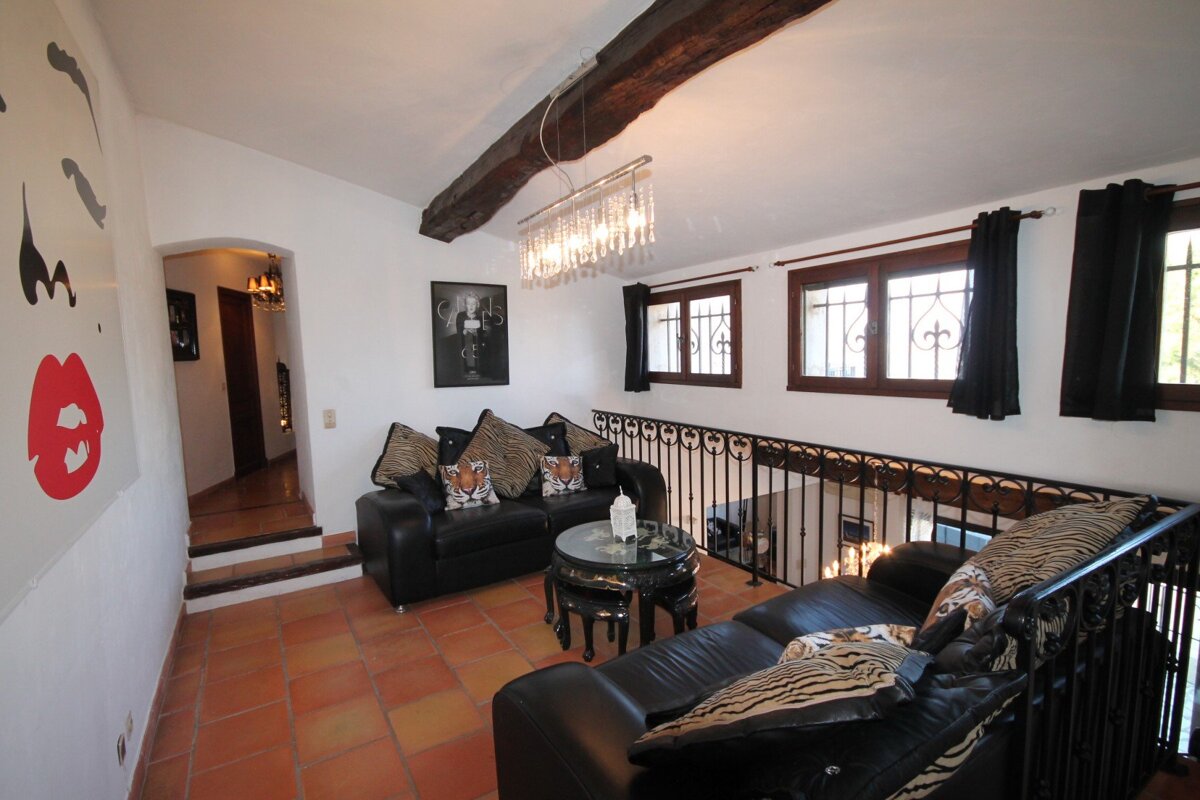 A living room with a couch and a table