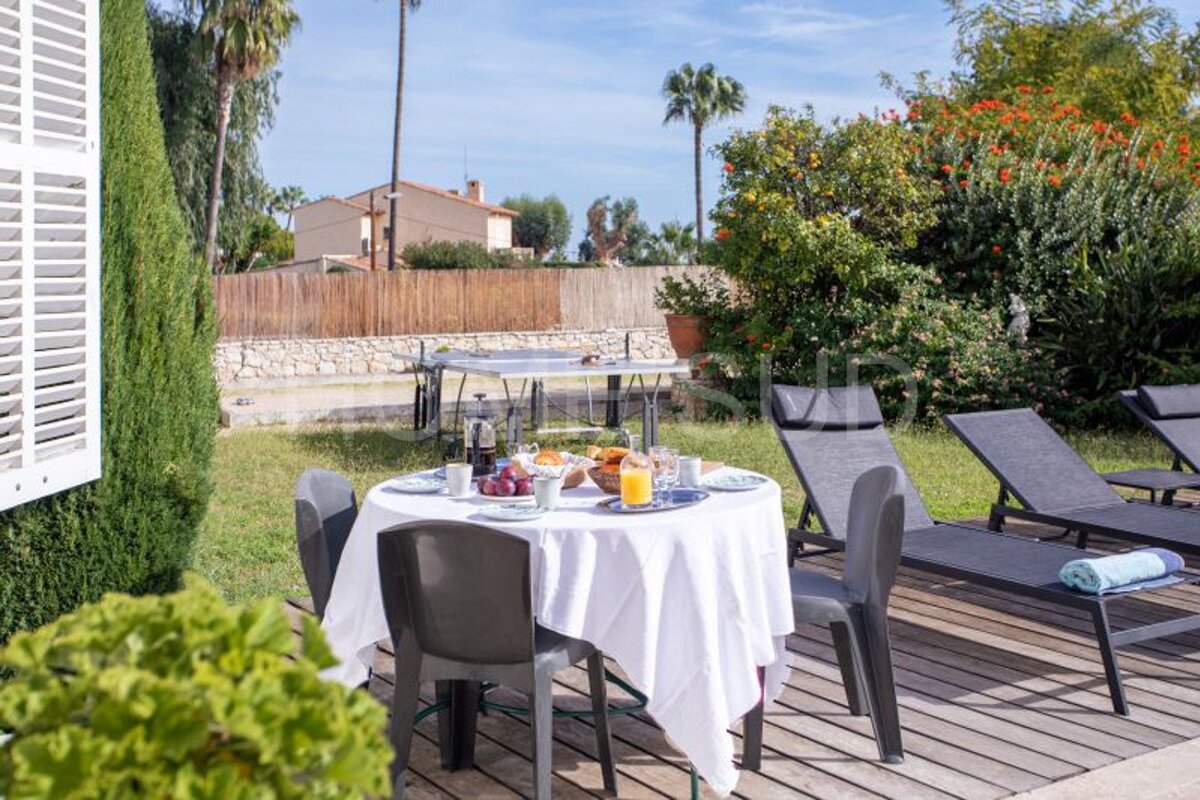 A table with a white table cloth and a plate of food on it