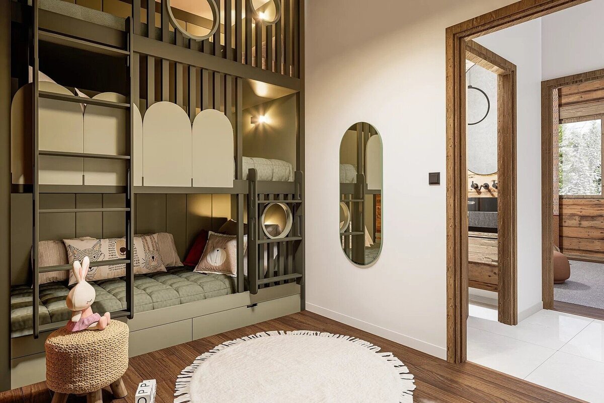 Cozy kids' room with modern olive-green bunk beds, a round white rug, an oval mirror, and doorways framed in warm wood.