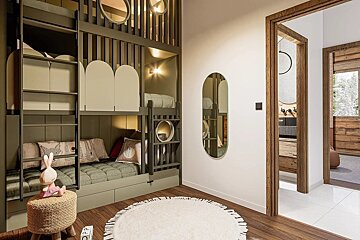 Cozy kids' room with modern olive-green bunk beds, a round white rug, an oval mirror, and doorways framed in warm wood.