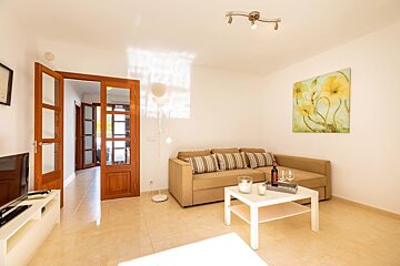 A living room with a couch and a coffee table