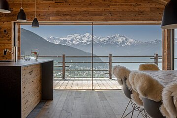 A kitchen with a view of a mountain range