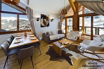 A living room with a couch a chair and a coffee table