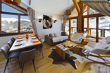 A living room with a couch a chair and a coffee table