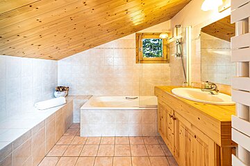 A bathroom with a bathtub and a sink