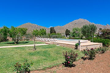 A swimming pool with a mountain in the background