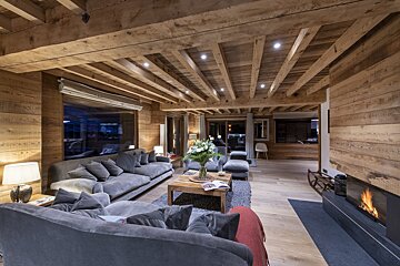 A living room filled with furniture and a fireplace