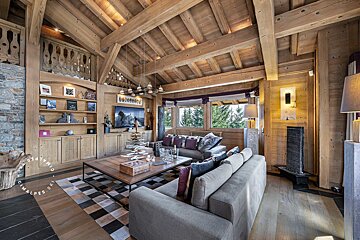 A living room with a couch a coffee table and a television