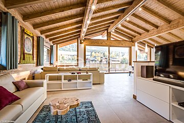 A living room with a couch and a flat screen tv