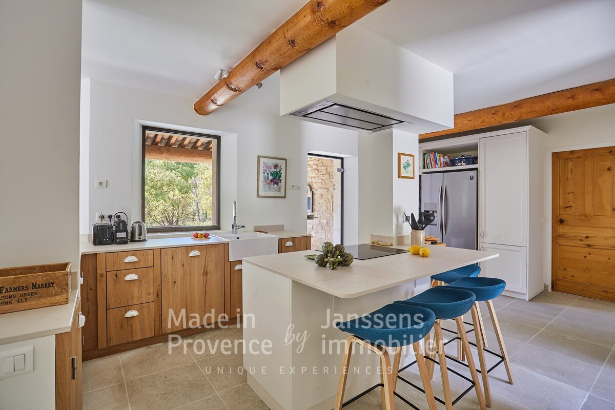 A kitchen with the words made in provence by immobilier