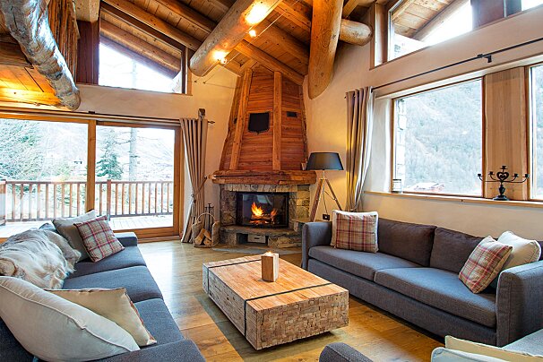 A living room with a fireplace and a couch