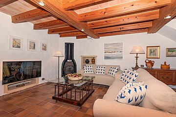 A living room with a couch and a fireplace