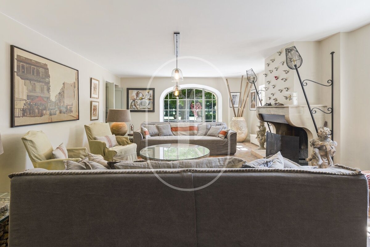 A living room with a fireplace and a couch