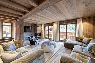 A living room filled with furniture and a fireplace