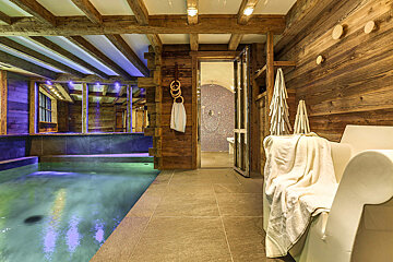 A bathroom with a bathtub and a swimming pool