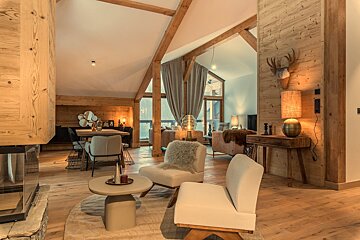 A living room with a fireplace and a flat screen tv