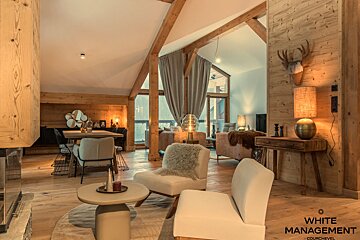 A living room with a fireplace and a flat screen tv