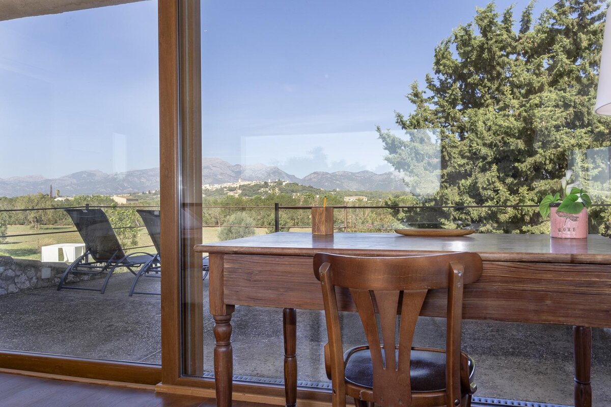 A desk with a chair and a potted plant with the word love on it