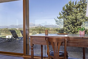 A desk with a chair and a potted plant with the word love on it