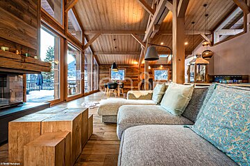 A living room with a couch and a fireplace