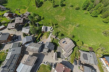 An aerial view of a small town with houses and trees