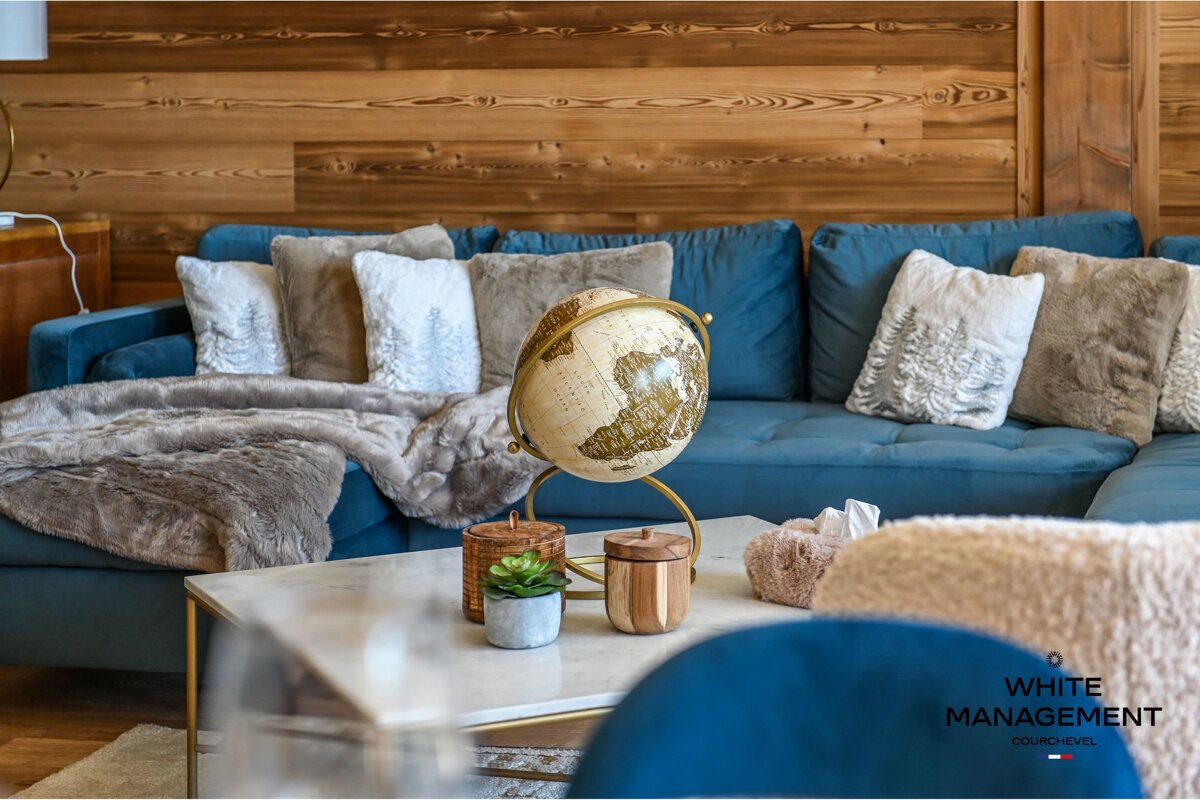 A bathroom with a rental designer logo on the corner