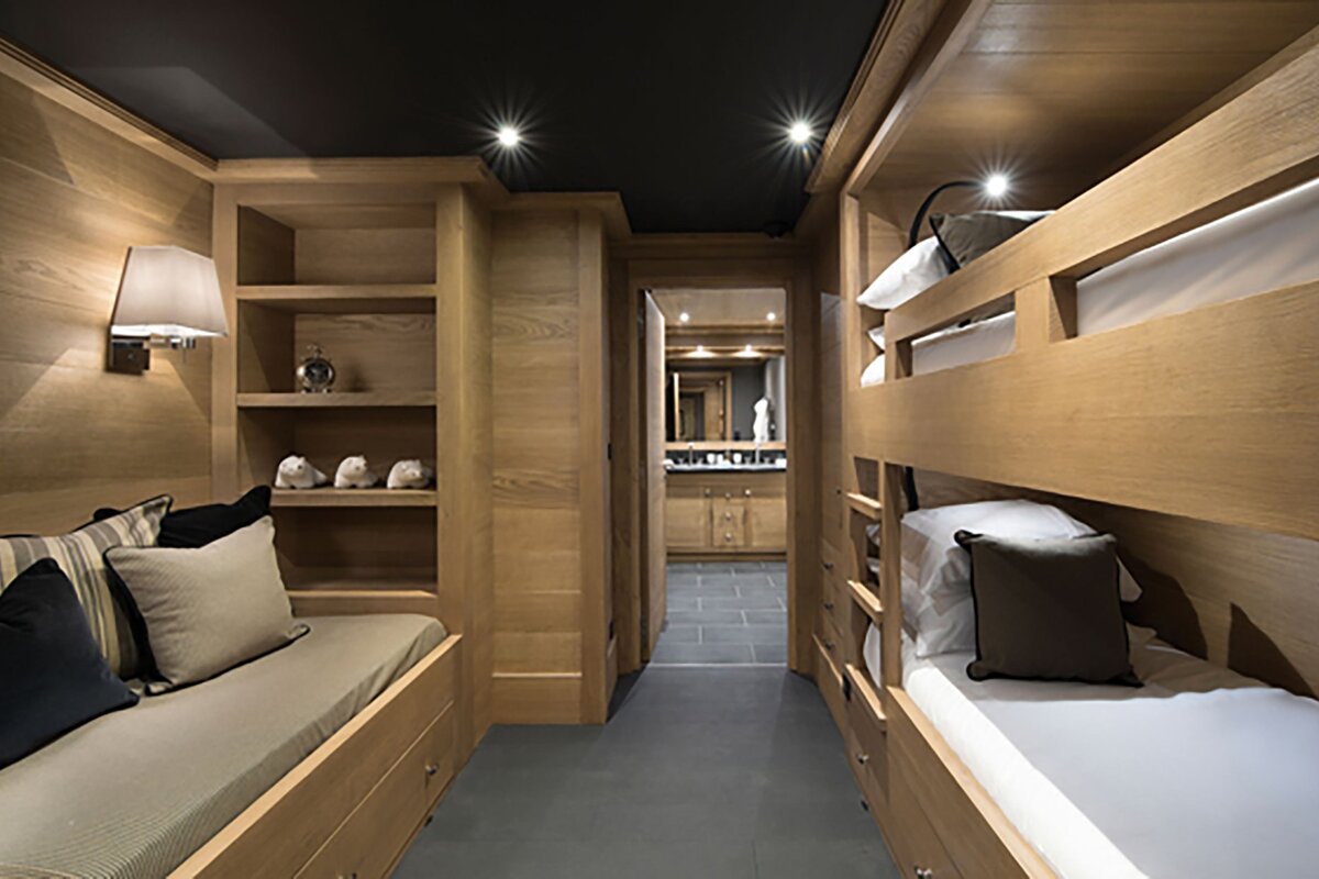 A bedroom with bunk beds and a couch