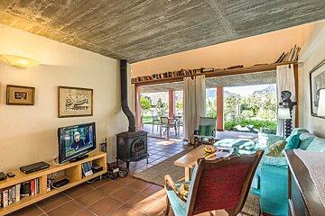 A living room with a flat screen tv and a fireplace