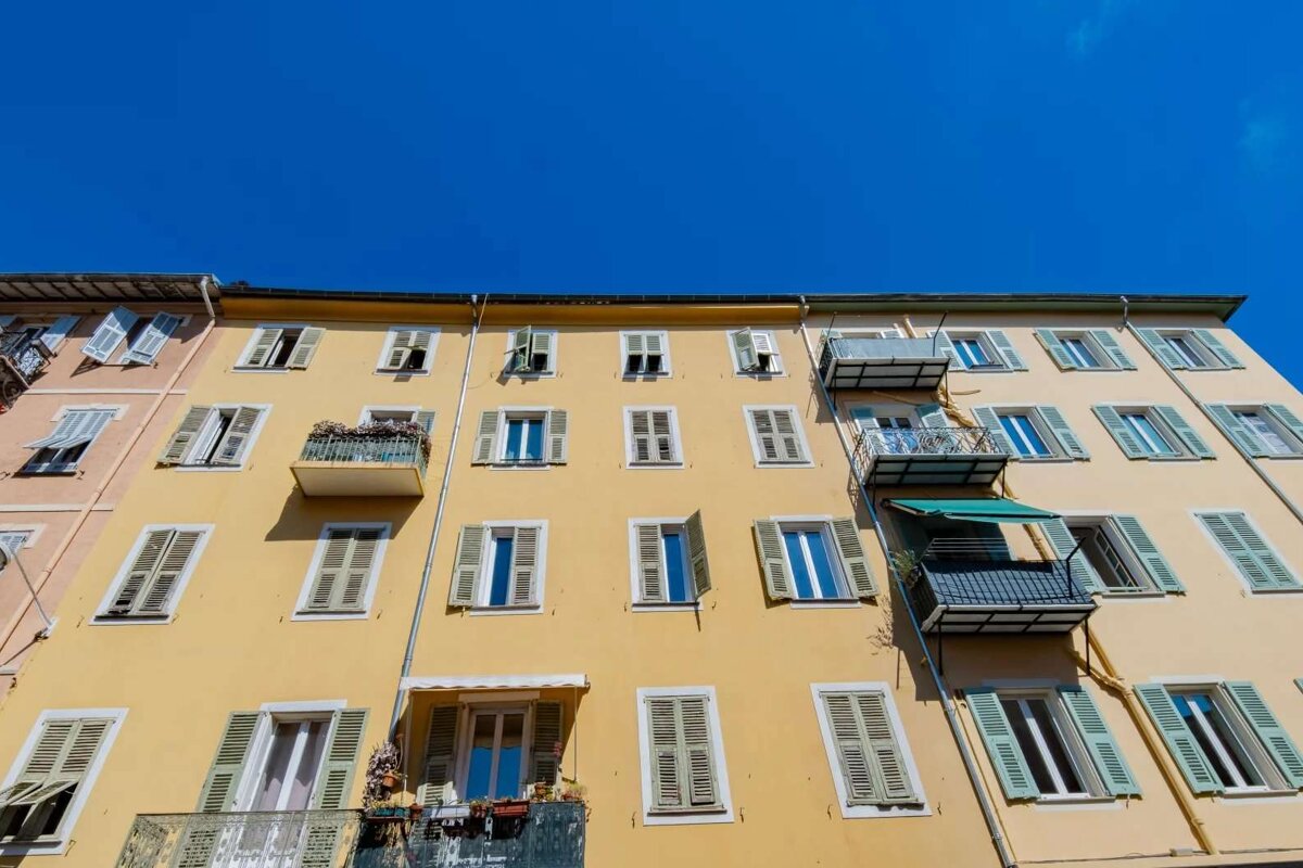 Looking up at a building with a blue sky in the background