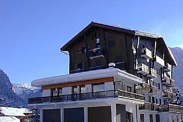 A large building with a lot of windows and balconies