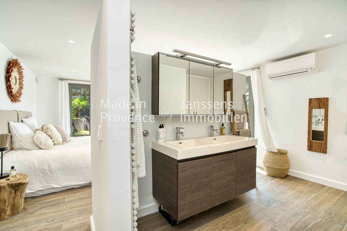 A bathroom with two sinks and the words made in provence on the wall
