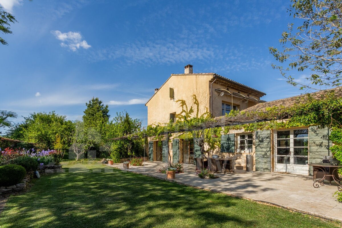 A large house with a patio in front of it