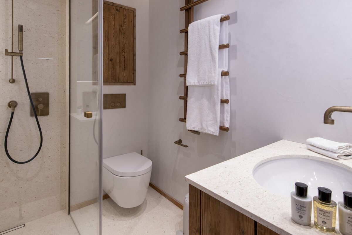 A bathroom with bottles of acqua di parma on the counter