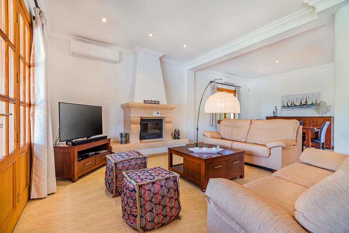 A living room with a fireplace and a couch