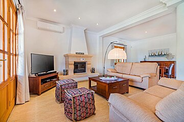 A living room with a fireplace and a couch