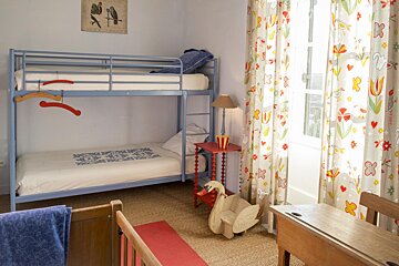 A child 's bedroom with a bunk bed and a desk