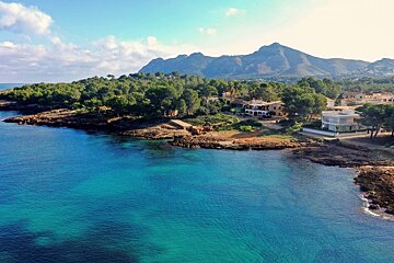 A large body of water with mountains in the background