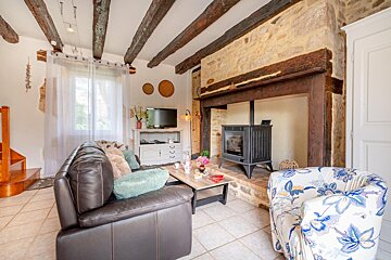 A living room with a fireplace and a couch