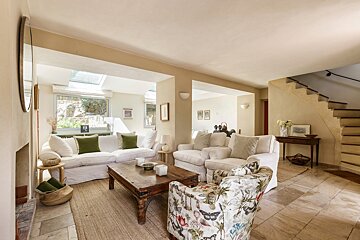 A living room with a couch a chair and a coffee table