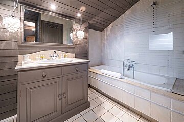 A bathroom with a sink and a bathtub