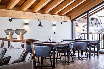 A living room with a couch and a table with a candle on it