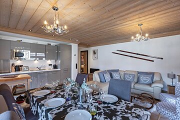 A living room with a cow print table cloth