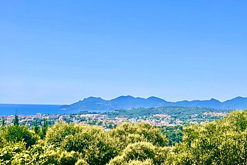 A view of a city with mountains in the background
