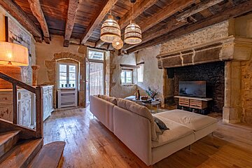 A living room with a couch and a television