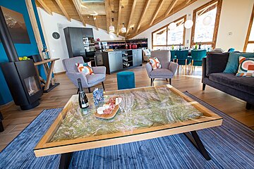 A living room with a map on the coffee table